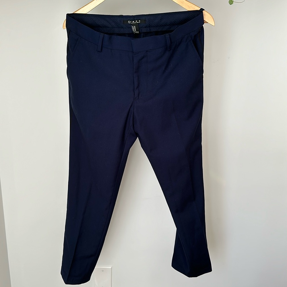 Navy dress pants with thin black stripe down outside of leg.